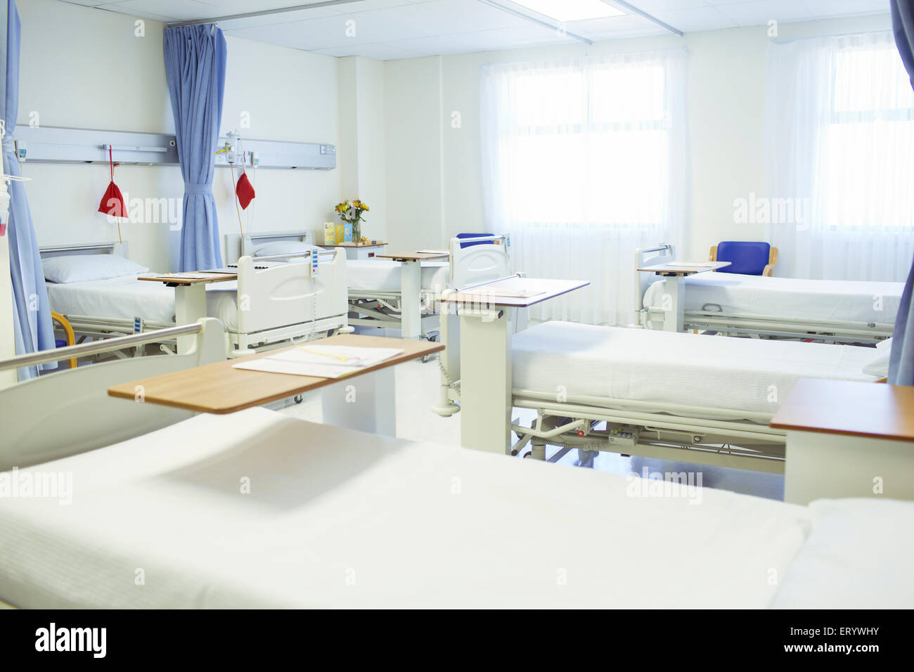 Beds ready in empty hospital room Stock Photo
