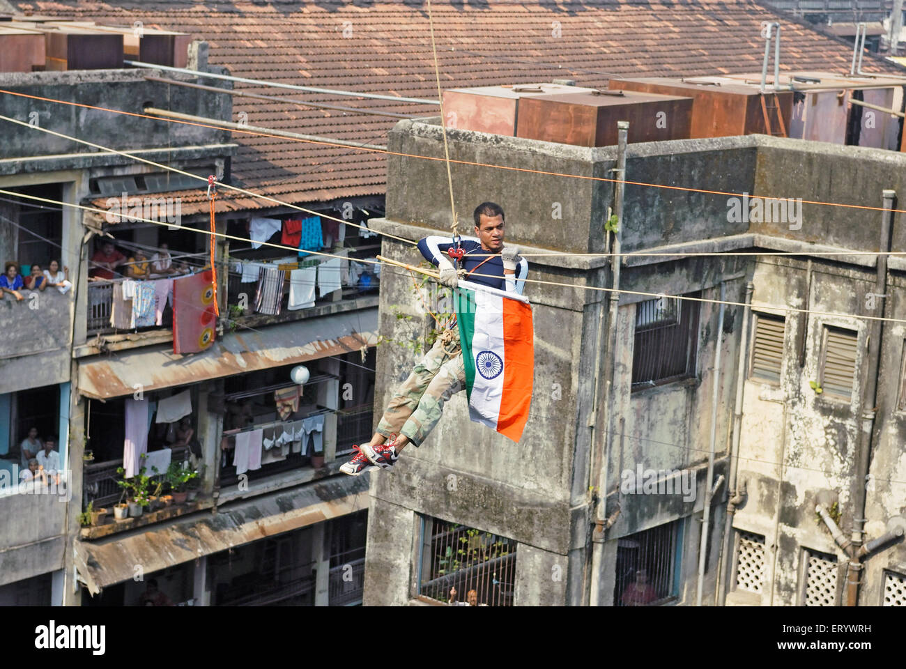 Gaurav sharma crossing between two buildings on rope ; Bombay ; Mumbai ; Maharashtra ; India NOMR Stock Photo