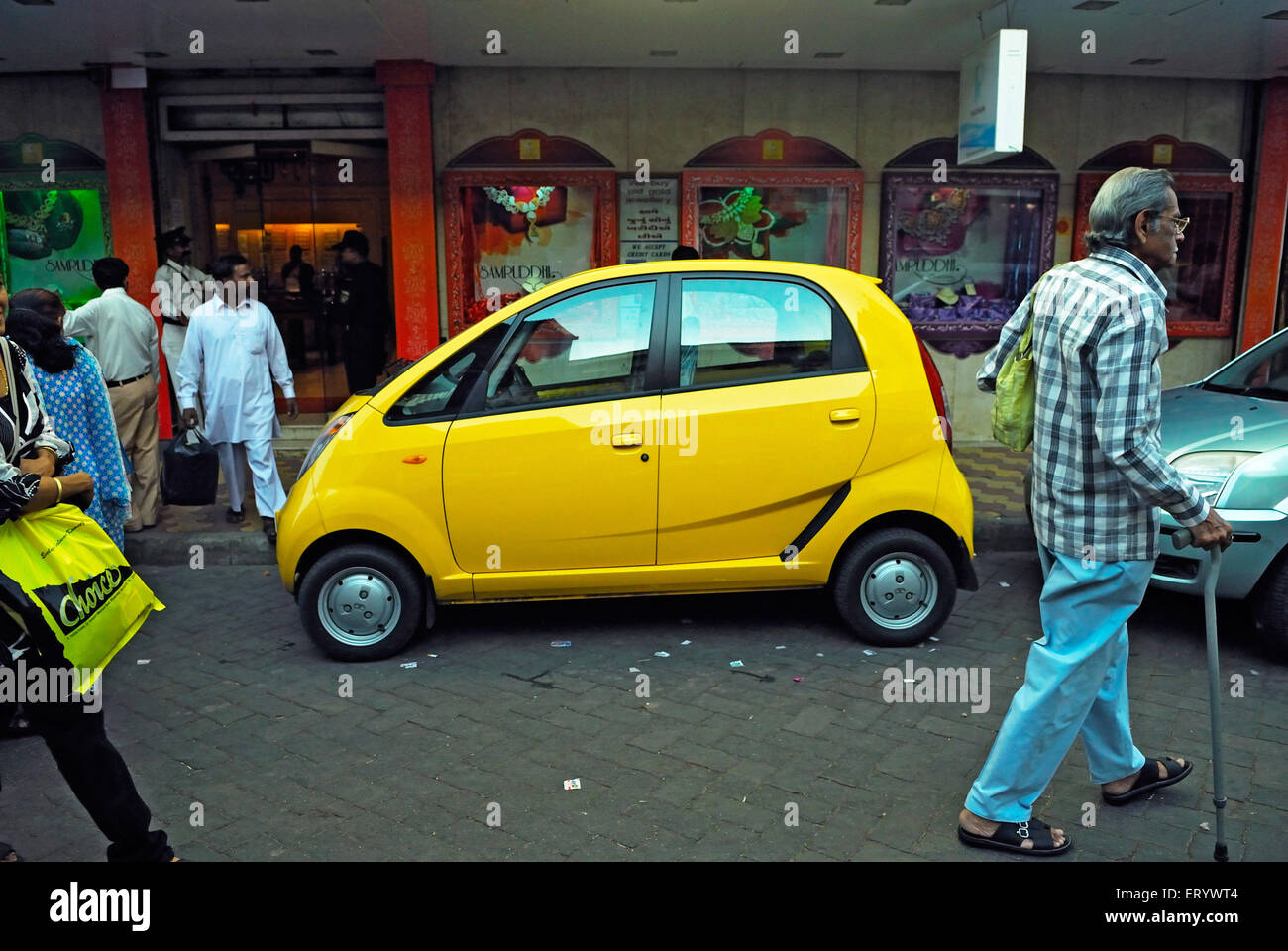 Tata nano car parked on the street ; Bombay ; Mumbai ; Maharashtra ; India Stock Photo