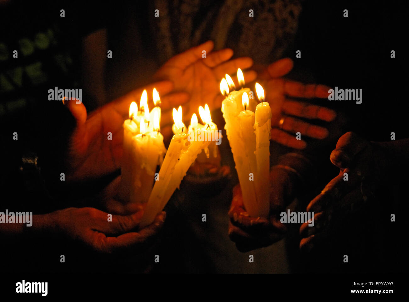 People lighting candles in memory of terror attack ; Bombay ; Mumbai ; Maharashtra ; India Stock Photo