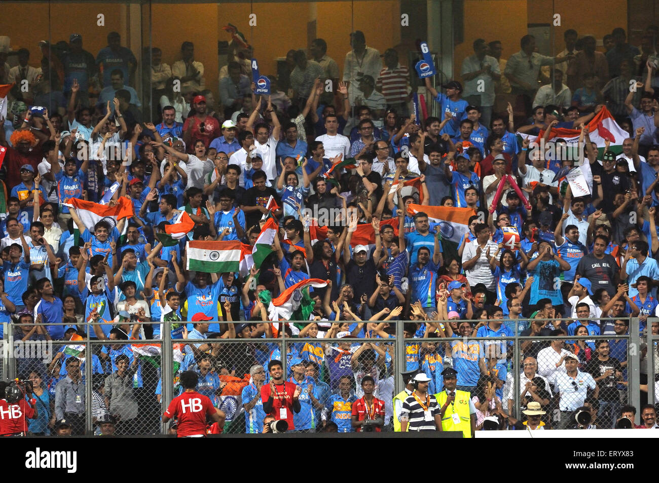 Indian fans wave national flags ICC Cricket World Cup finals Sri Lanka played Wankhede stadium Mumbai Stock Photo