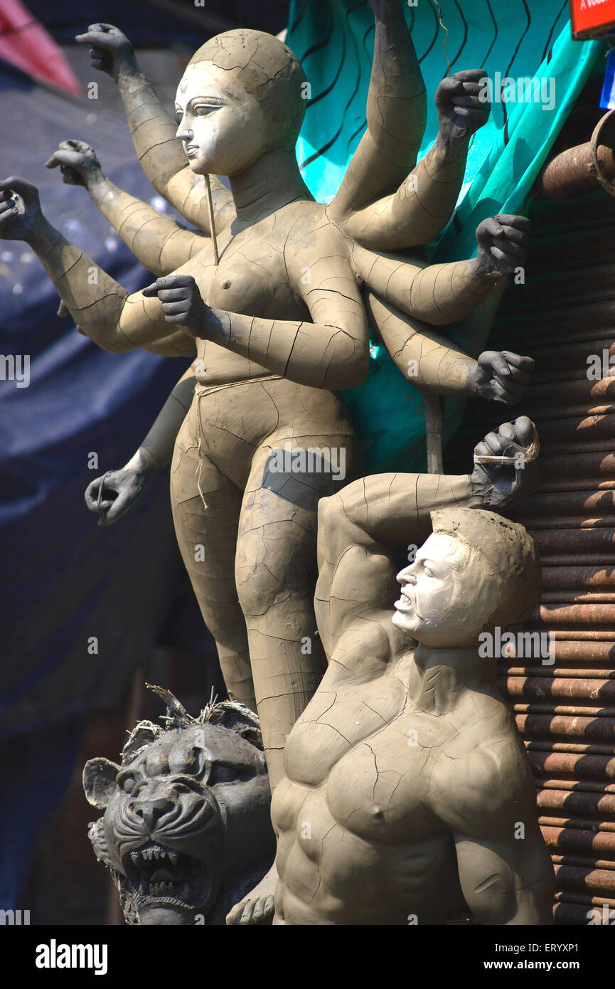 Unfinished goddess durga statue with demon ; Calcutta Kolkata ; West Bengal ; India Stock Photo