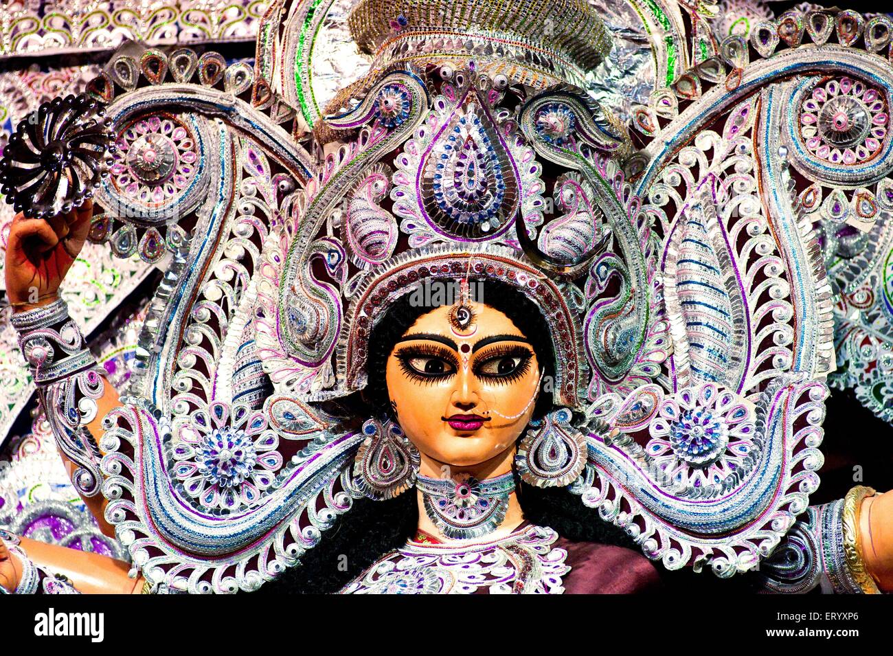 Goddess durga warrior pose with divine weapons on durga puja ; Calcutta Kolkata ; West Bengal ; India Stock Photo