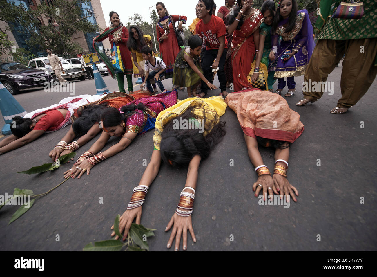 woman lying on the road Chhat worship Babughat kolkata India Asia Stock Photo