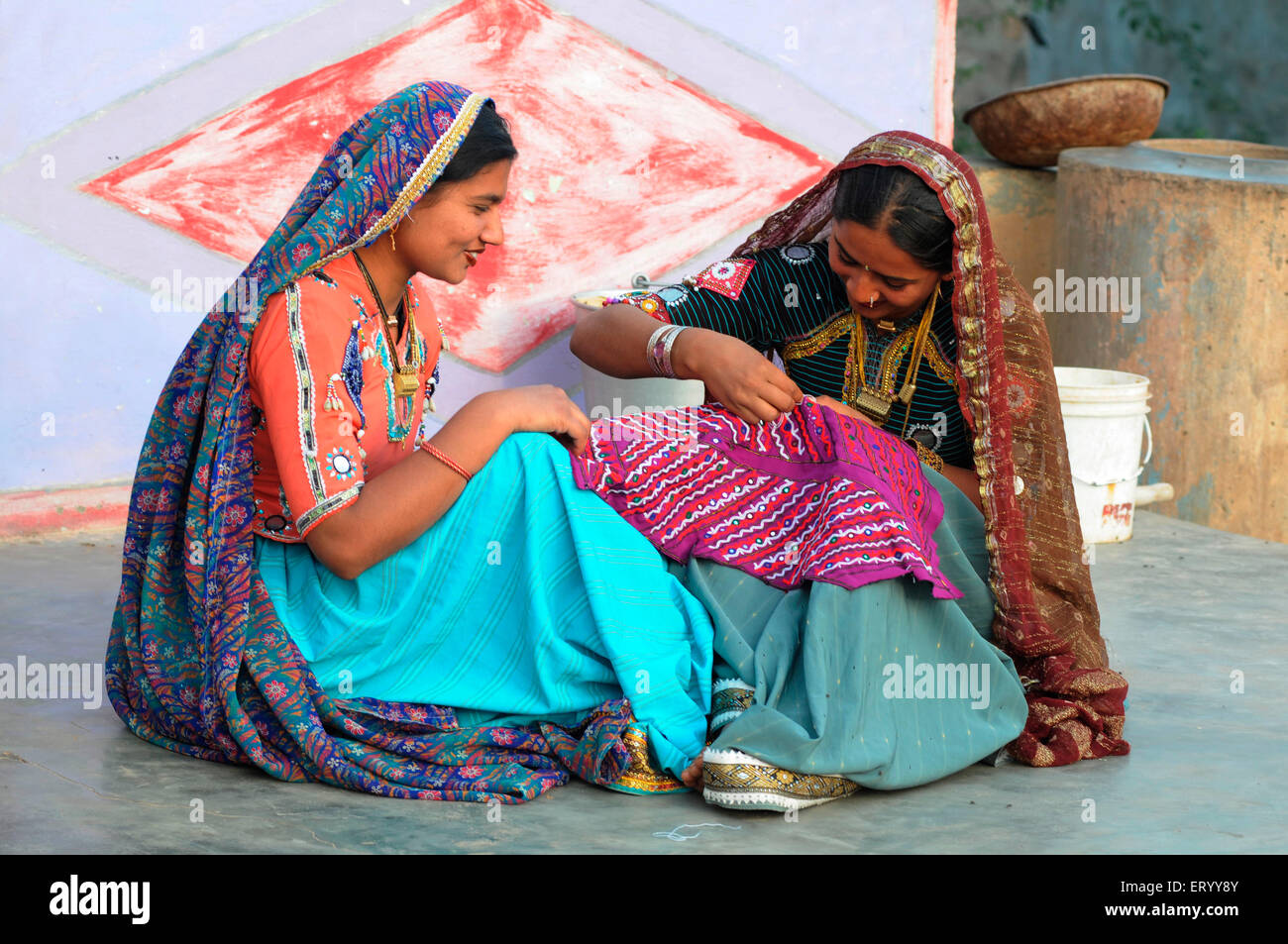 Rabari girls sewing , Bhuj , Kutch , Gujarat , India , Model Release # 771E & 771D Stock Photo