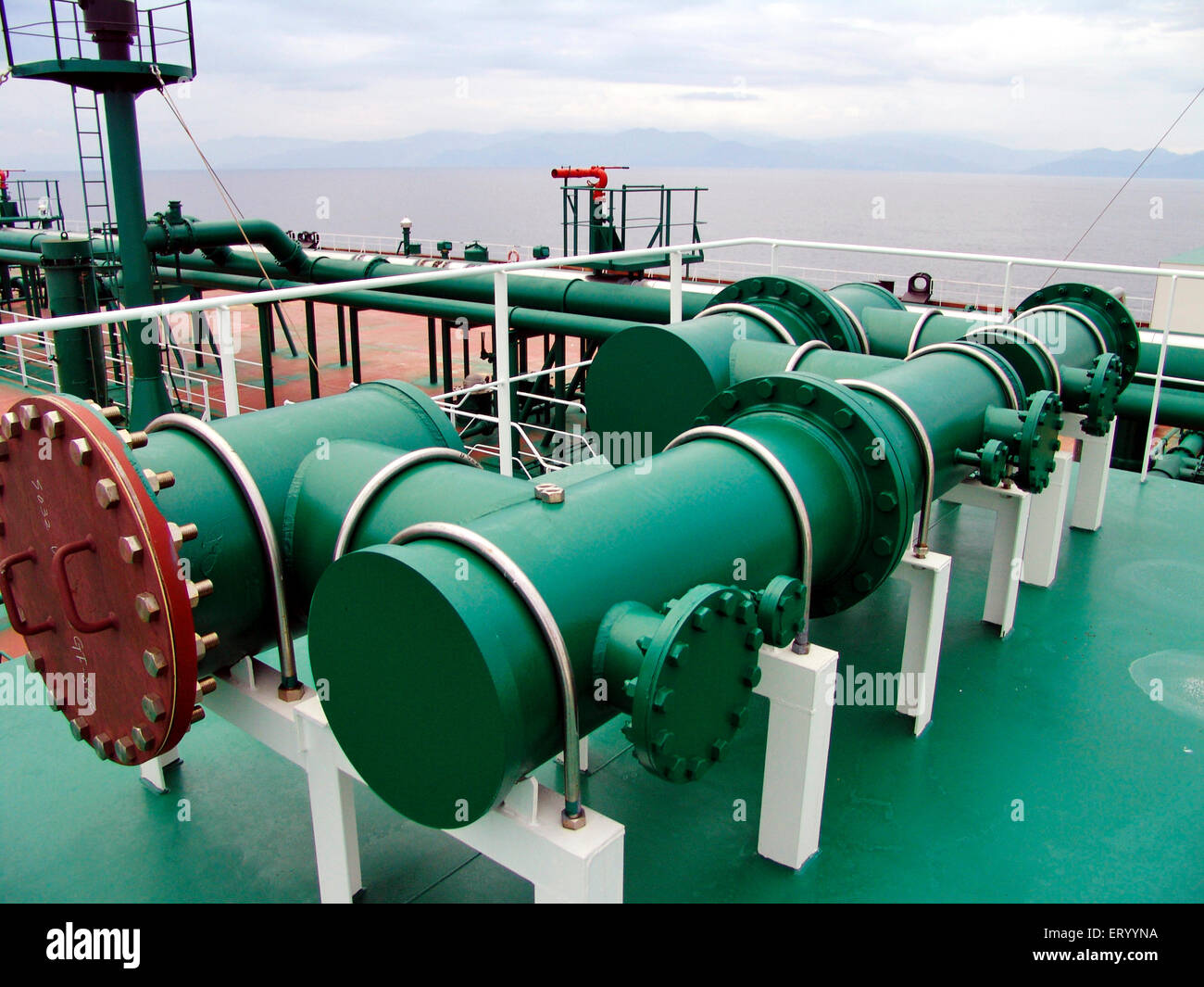 Oil pipes on merchant vessel ship Stock Photo