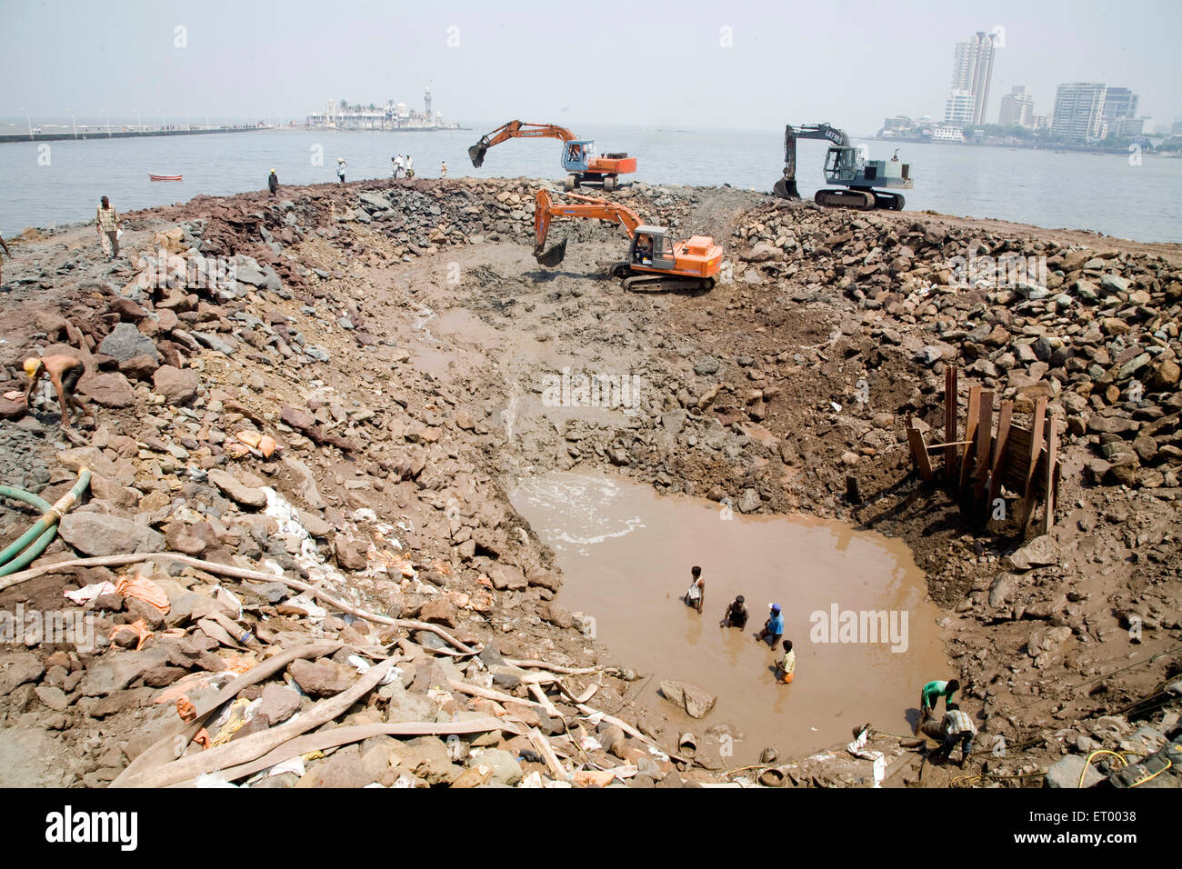 Workers at construction site haji ali ; Bombay Mumbai ; Maharashtra ; India Stock Photo