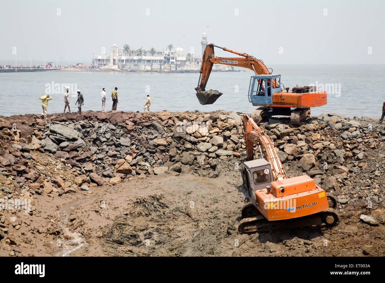 Workers at construction site haji ali ; Bombay Mumbai ; Maharashtra ; India Stock Photo
