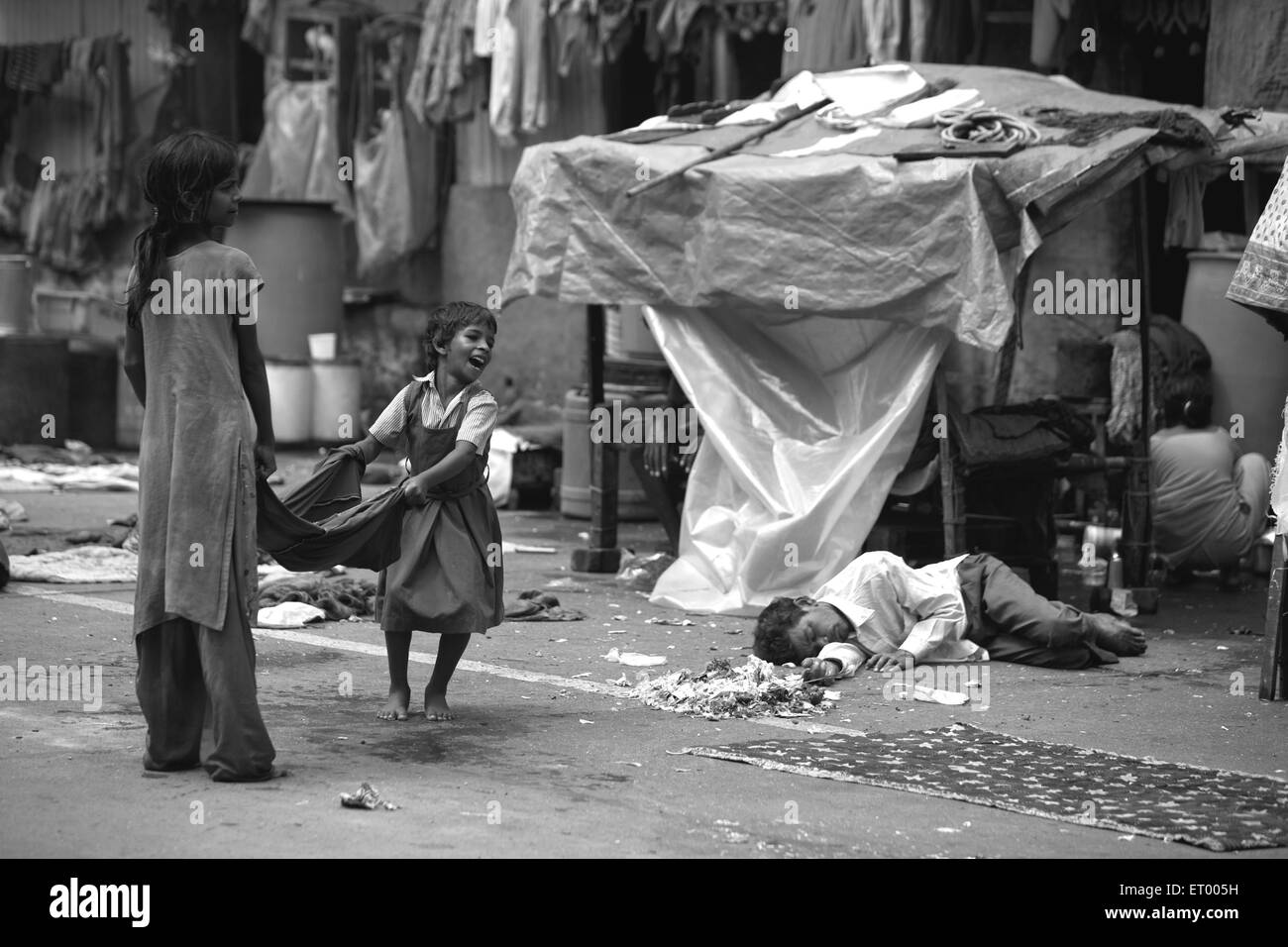 Children playing in Byculla slum ; N M Joshi Road ; Bombay Mumbai ; Maharashtra ; India NO MR Stock Photo