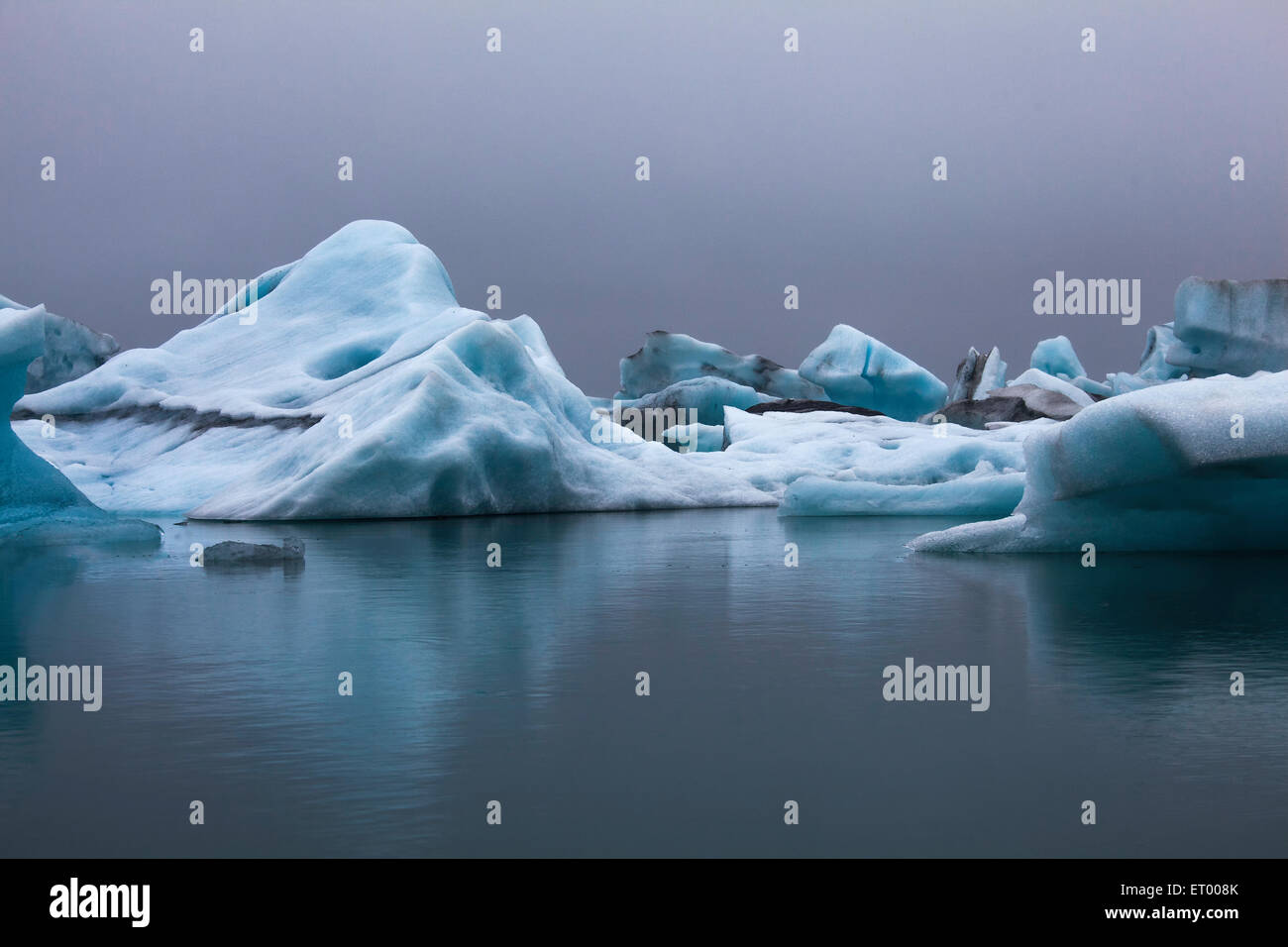 Blue icebergs in calm water, Jokulsarlon, Iceland Stock Photo