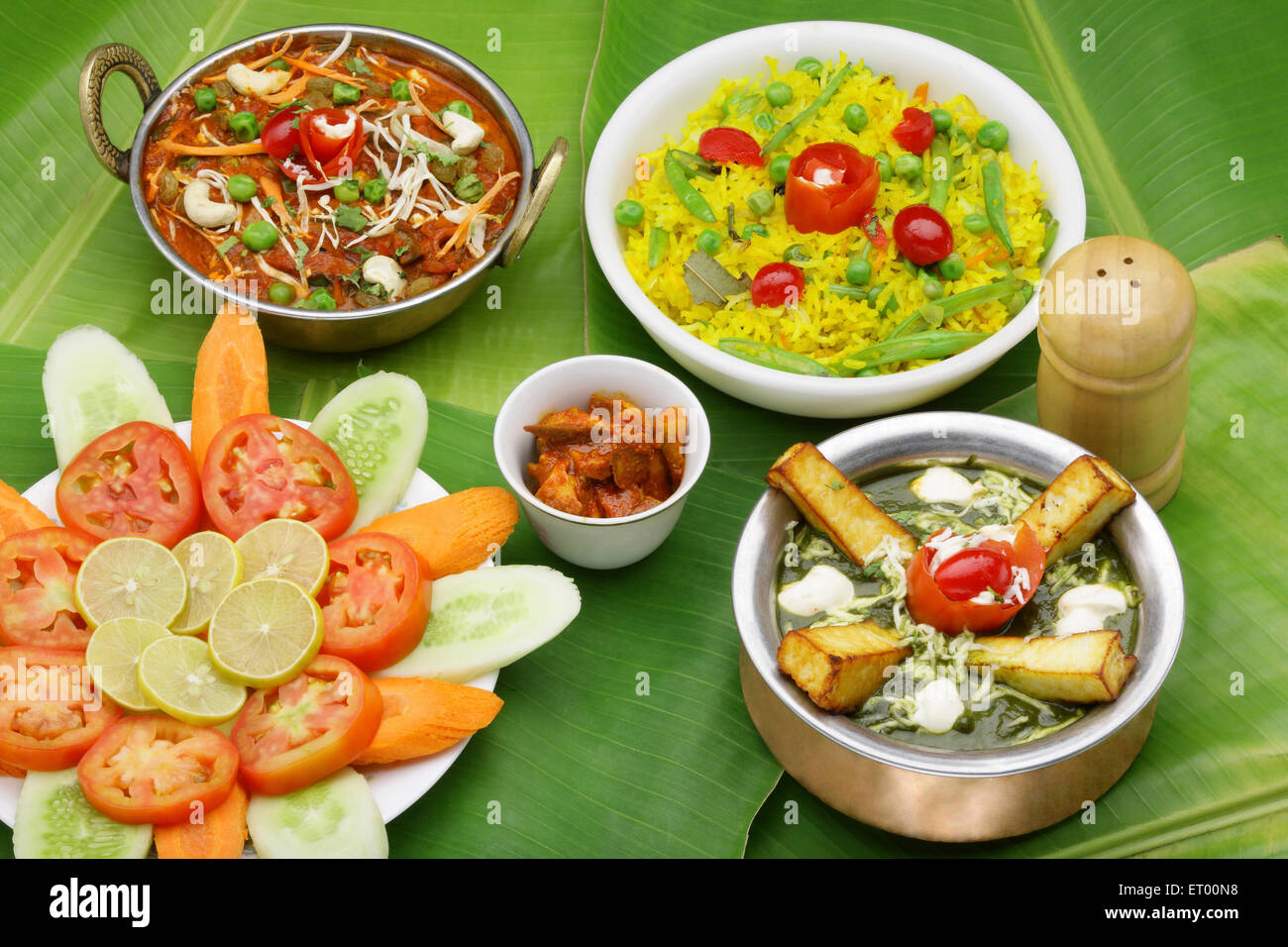 Food Indian ; vegetarian kolhapuri in copper kadhai ; palak paneer in copper handi ; green peas