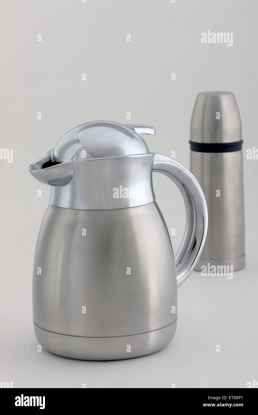 Stainless steel jug and thermos flask on white background Stock Photo