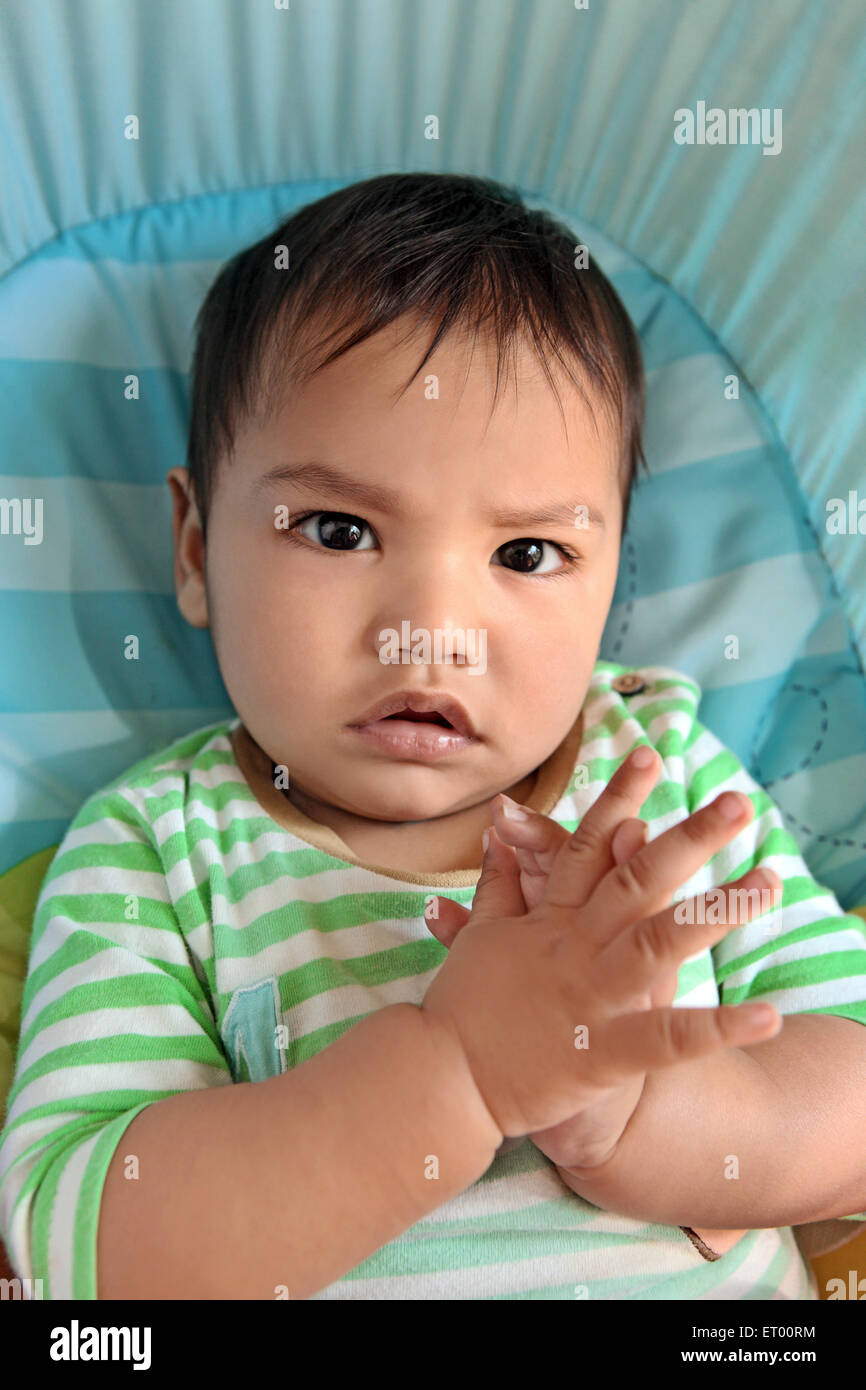 Baby boy with finger crossed MR#732 Stock Photo