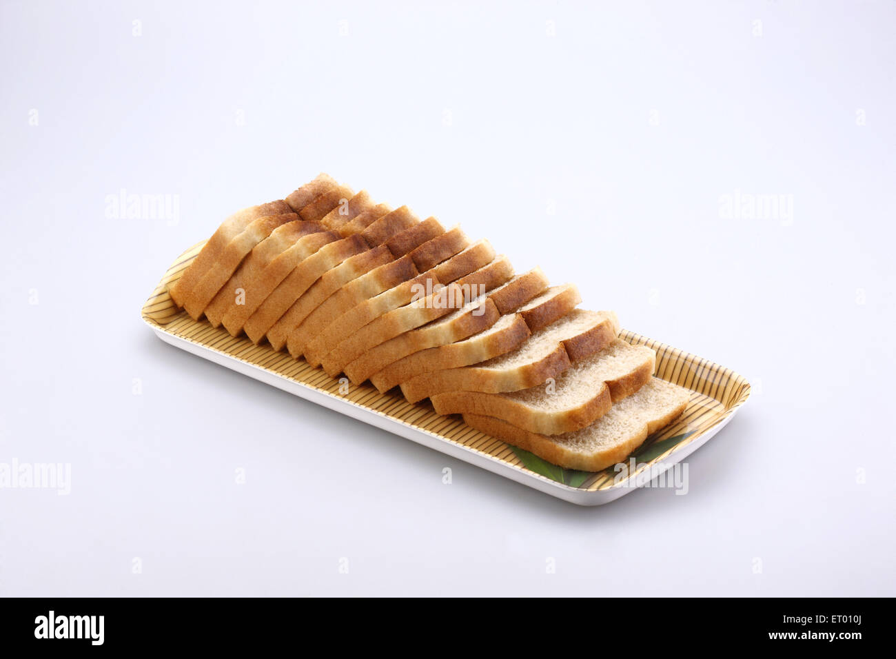 Sliced brown bread on white background Stock Photo - Alamy