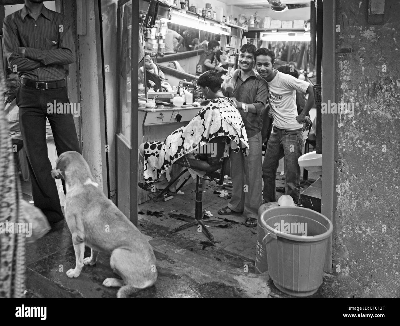 Barber shop in Dharavi slum ; Bombay Mumbai ; Maharashtra ; India NO MR Stock Photo