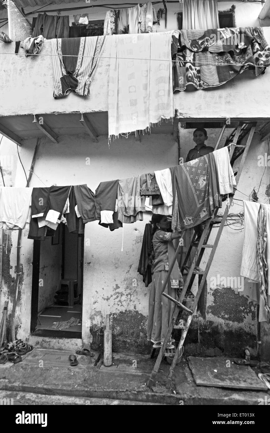 Clothes drying on rope in Dharavi slum ; Bombay Mumbai ; Maharashtra ; India Stock Photo