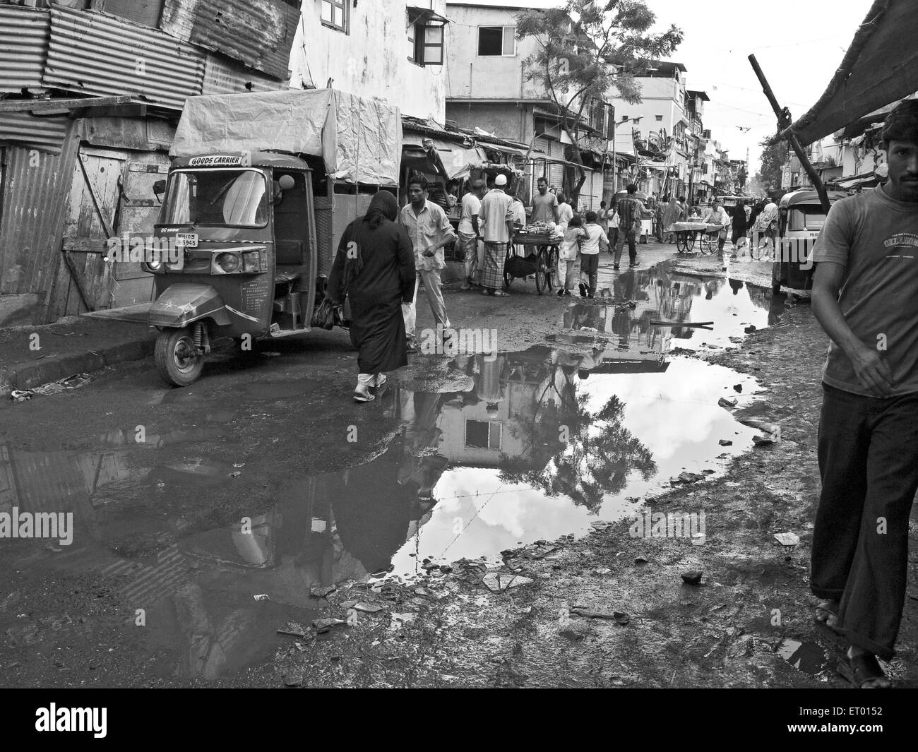 Water puddle in Bhatwadi and Devnar slum ; Bombay Mumbai ; Maharashtra ; India Stock Photo