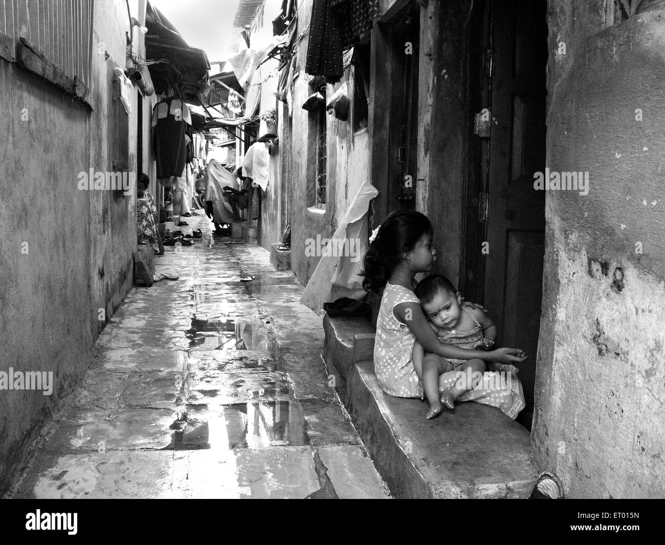 Narrow lane in slum ; Bombay Mumbai ; Maharashtra ; India Stock Photo