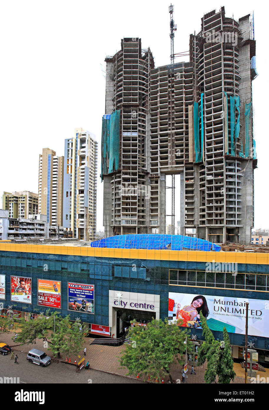 Construction of buildings and shopping complex in mumbai central area Bombay Mumbai ; Maharashtra ; India Stock Photo