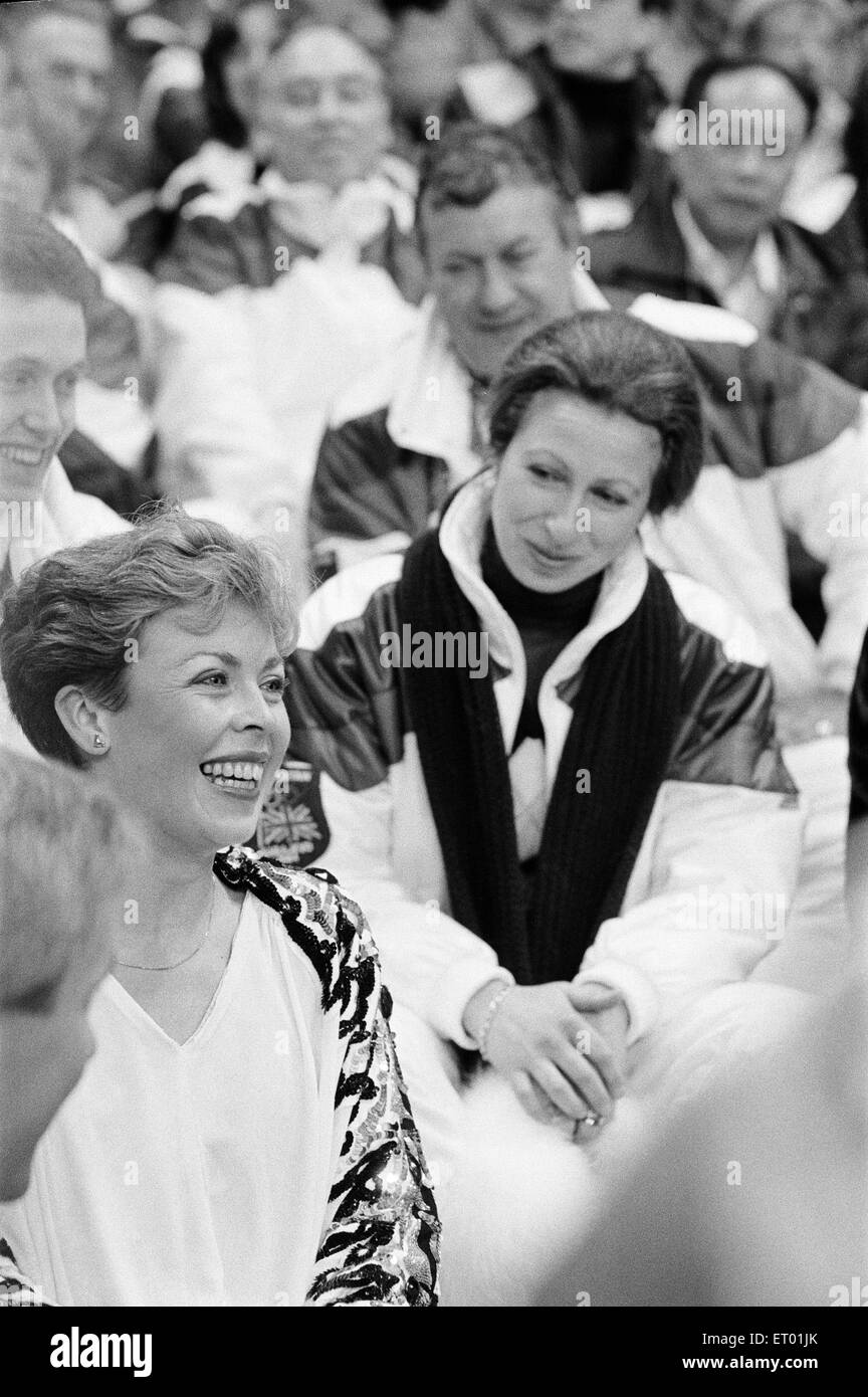 1984 Winter Olympics, 12th February 1984. Figure skating, Fourth Round, Zetra Stadium, Sarajevo, Yugoslavia. Jayne Torvill and Christopher Dean sit in audience with Princess Anne, after performing their Paso Doble routine. Stock Photo