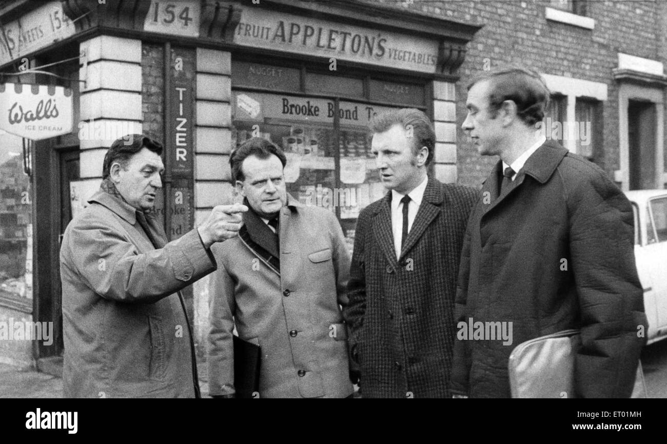 Detective Chief Supt. Harvey Burrows with police officers outside the shop where Allan Graham was last seen. 11-year-old Allan's body was found dumped in a ditch near Throckley in April 1970 after he went to a corner shop near his step-brothers home in Gerald Street, Benwell, Newcastle. 28th January 1970. Stock Photo