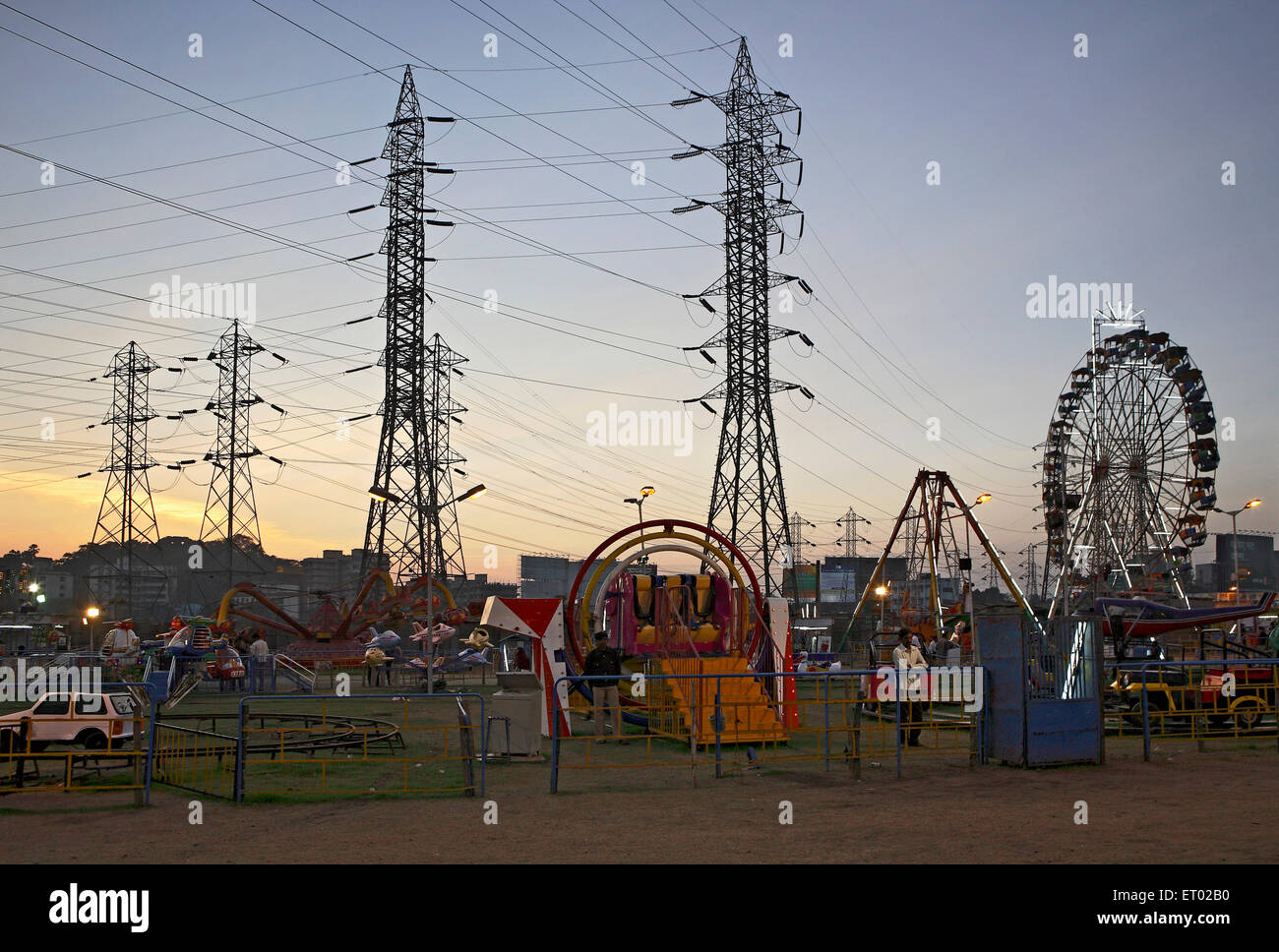 Ferris Wheel, Giant Wheel, amusement ride, electricity transmission tower, India, Asia Stock Photo