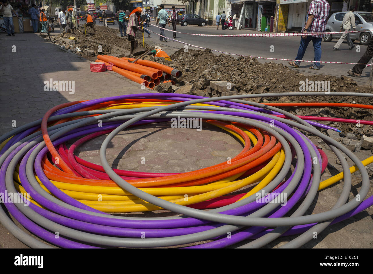 Under Ground Laying of PVC Multi Color Pipes in Ghatkopar at Mumbai India Asia Stock Photo
