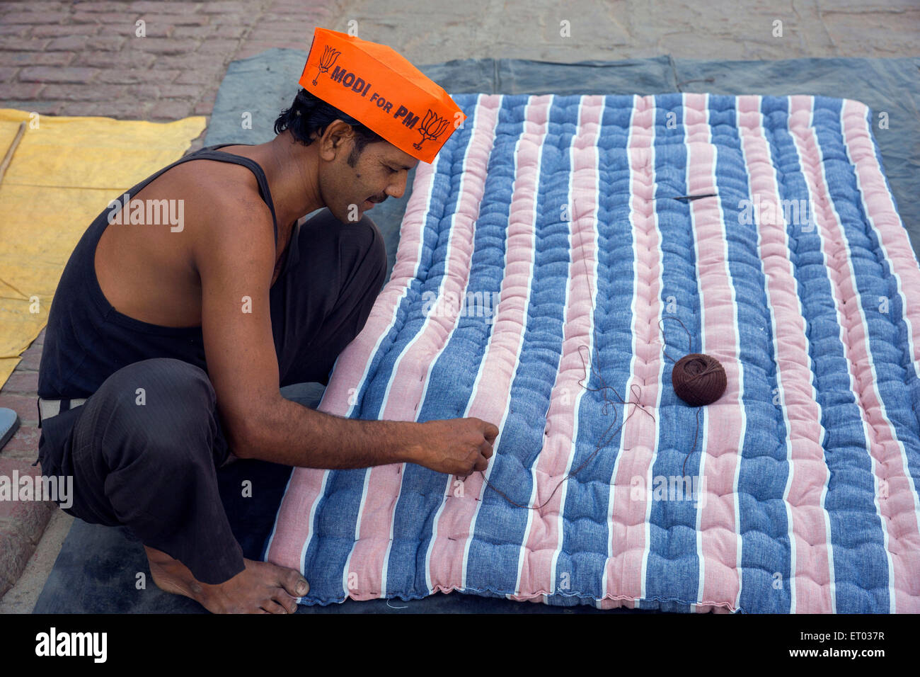 Mattress Maker Wearing Modi Cap Varanasi uttar pradesh India Asia Stock Photo