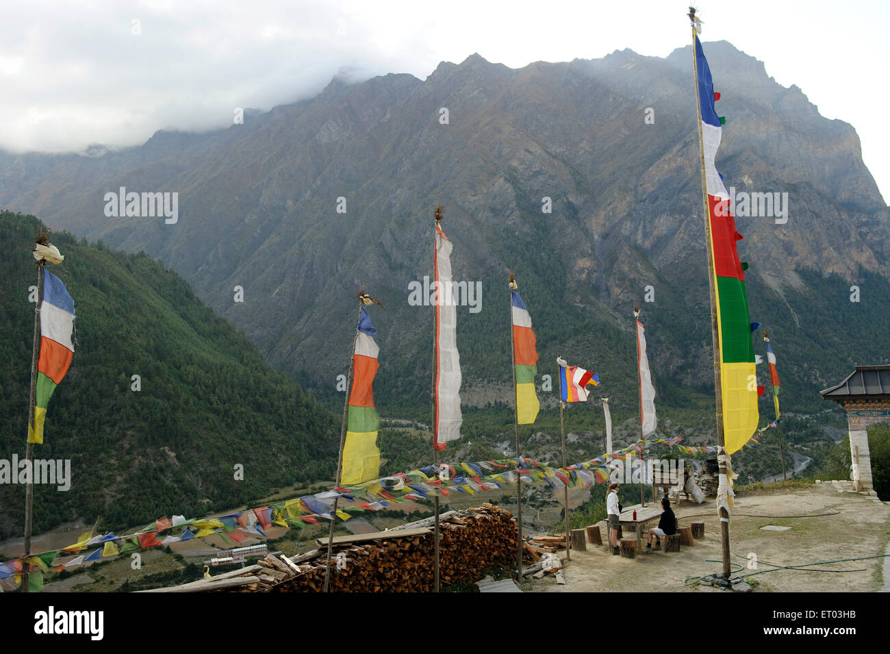 Buddhist prayer flags , Upper Pisang , Pisang , Nepal , Federal Democratic Republic of Nepal , South Asia , Asia Stock Photo