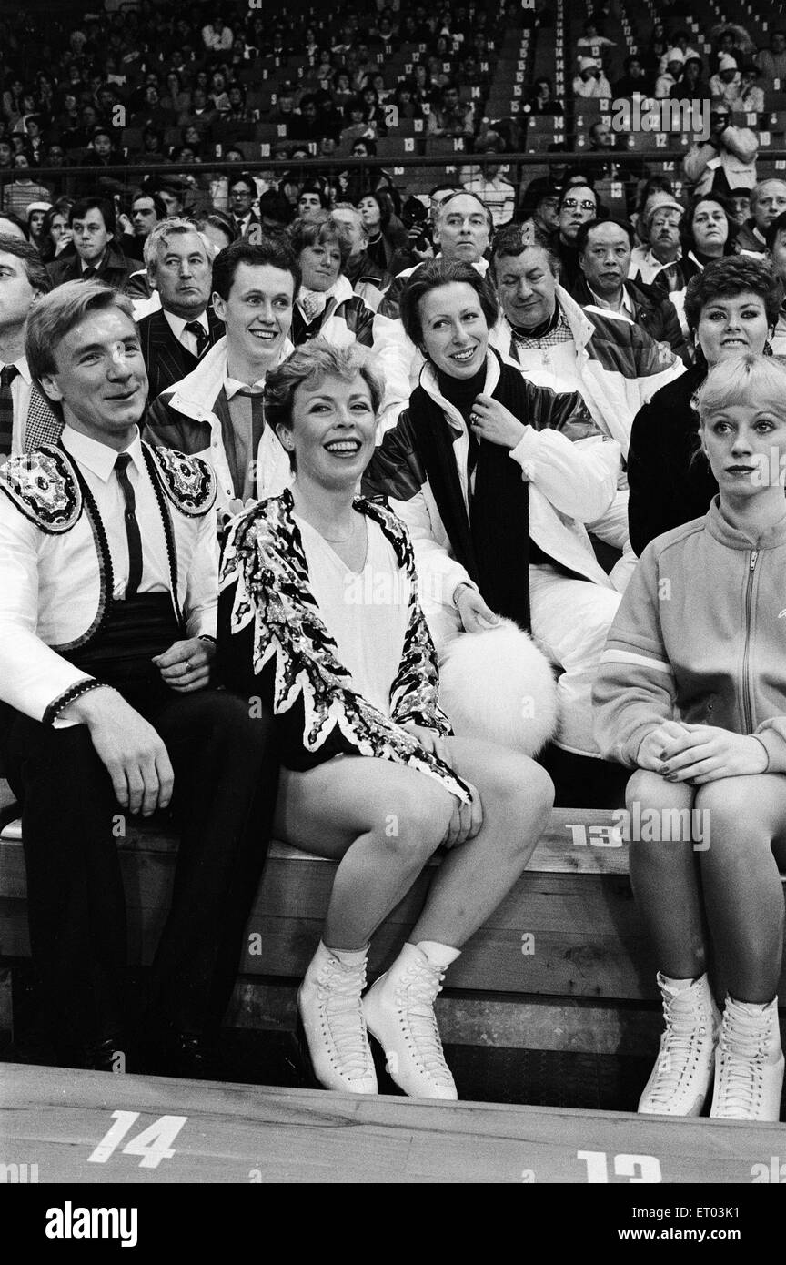 1984 Winter Olympics, 12th February 1984. Figure skating, Fourth Round, Zetra Stadium, Sarajevo, Yugoslavia. Jayne Torvill and Christopher Dean sit in audience with Princess Anne, after performing their Paso Doble routine. Stock Photo