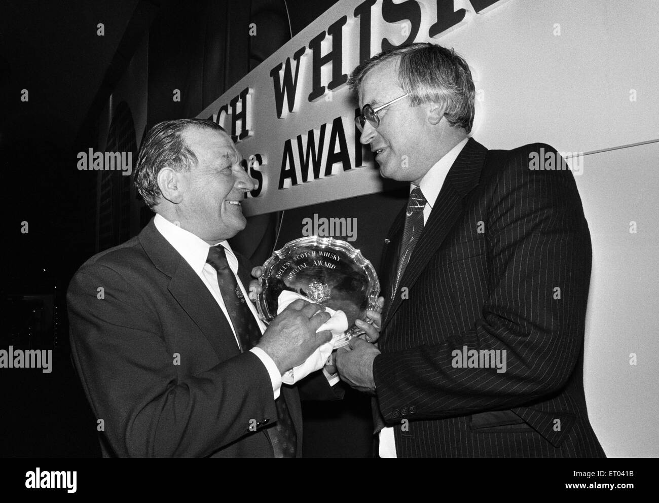 Bells Scotch Whisky Football Managers Awards. Leicester City manager Jock Wallace who won the Special Award for taking his side back in to the First Division is presented the award by Liverpool manager Bob Paisley who won the Manager of the Year Award for the fourth time in five years. 24th May 1980. Stock Photo