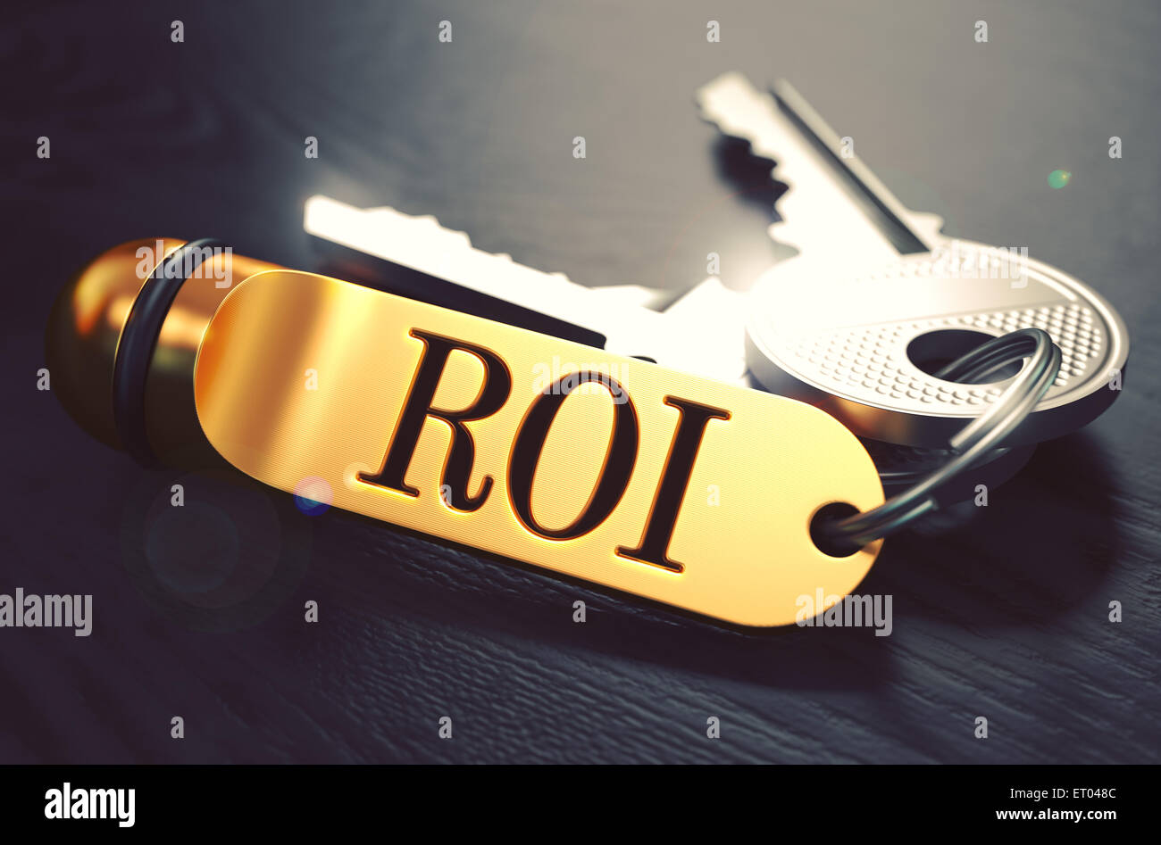 ROI written on Golden Keyring. Stock Photo