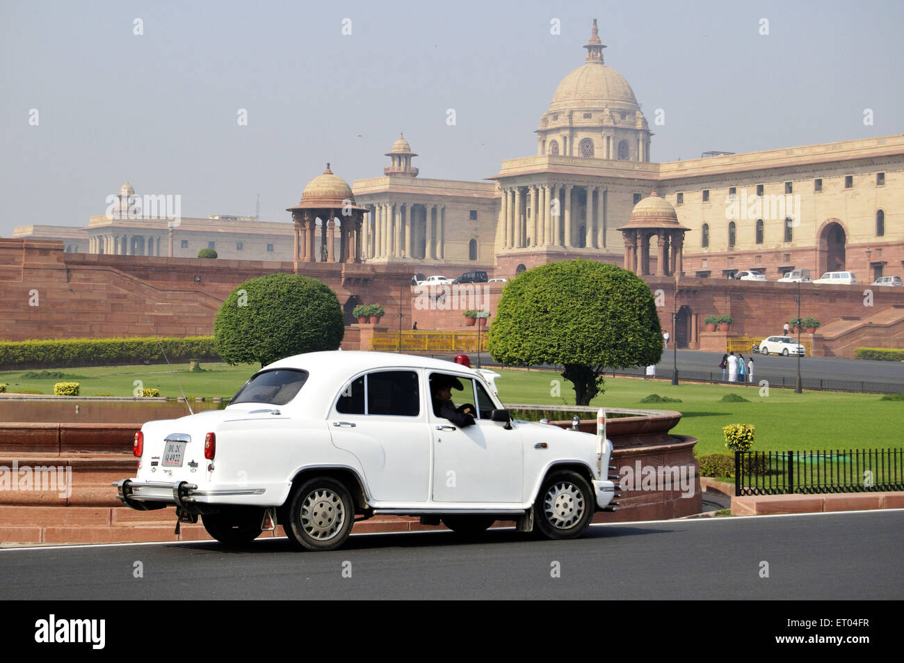 White Ambassador Government car at Parliament House ; North Block and South Block at New Delhi ; India ; Asia Stock Photo