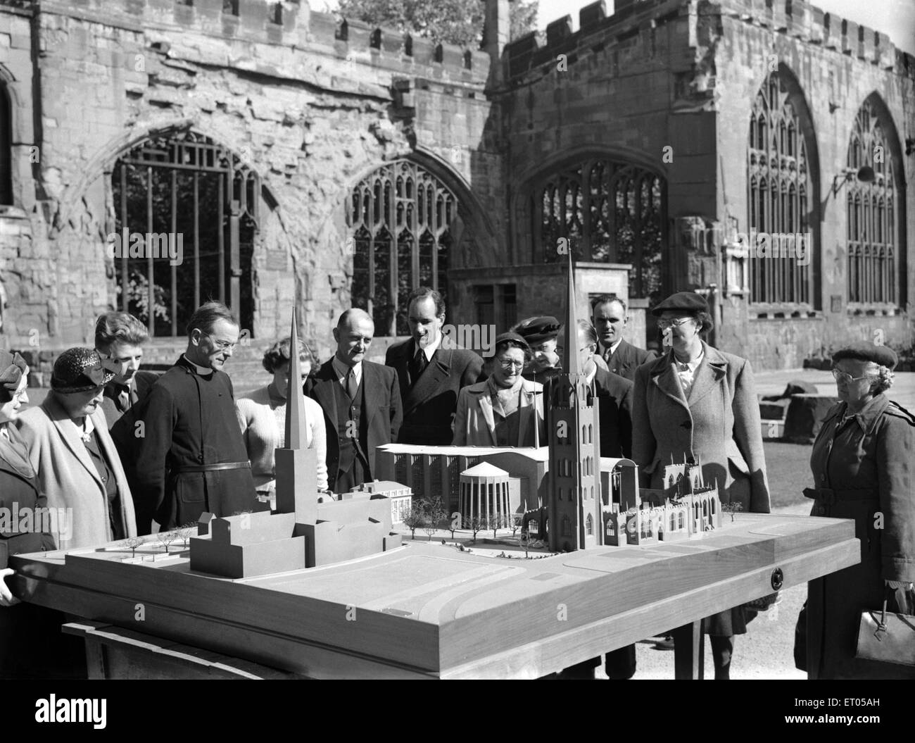 A model of Sir Basil Spence new cathedral for Coventry, West Midlands (formerly Warwickshire) is displayed in the ruins of the old medieval cathedral which was destroyed by the German airforce in the blitz of November 1940. Circa 1952 Stock Photo