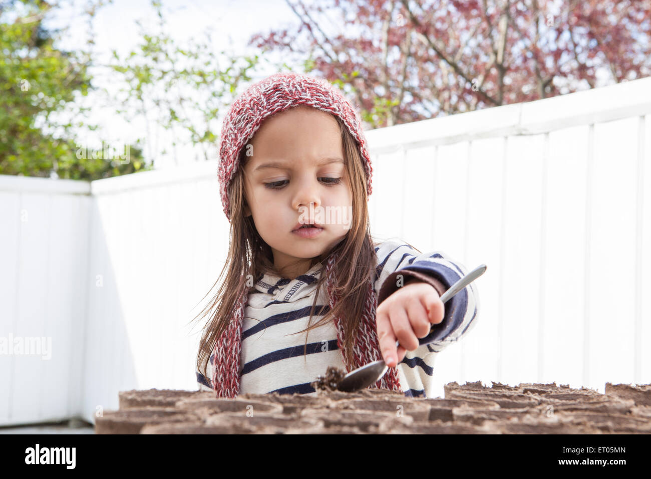 Girl gardening on patio Stock Photo Alamy
