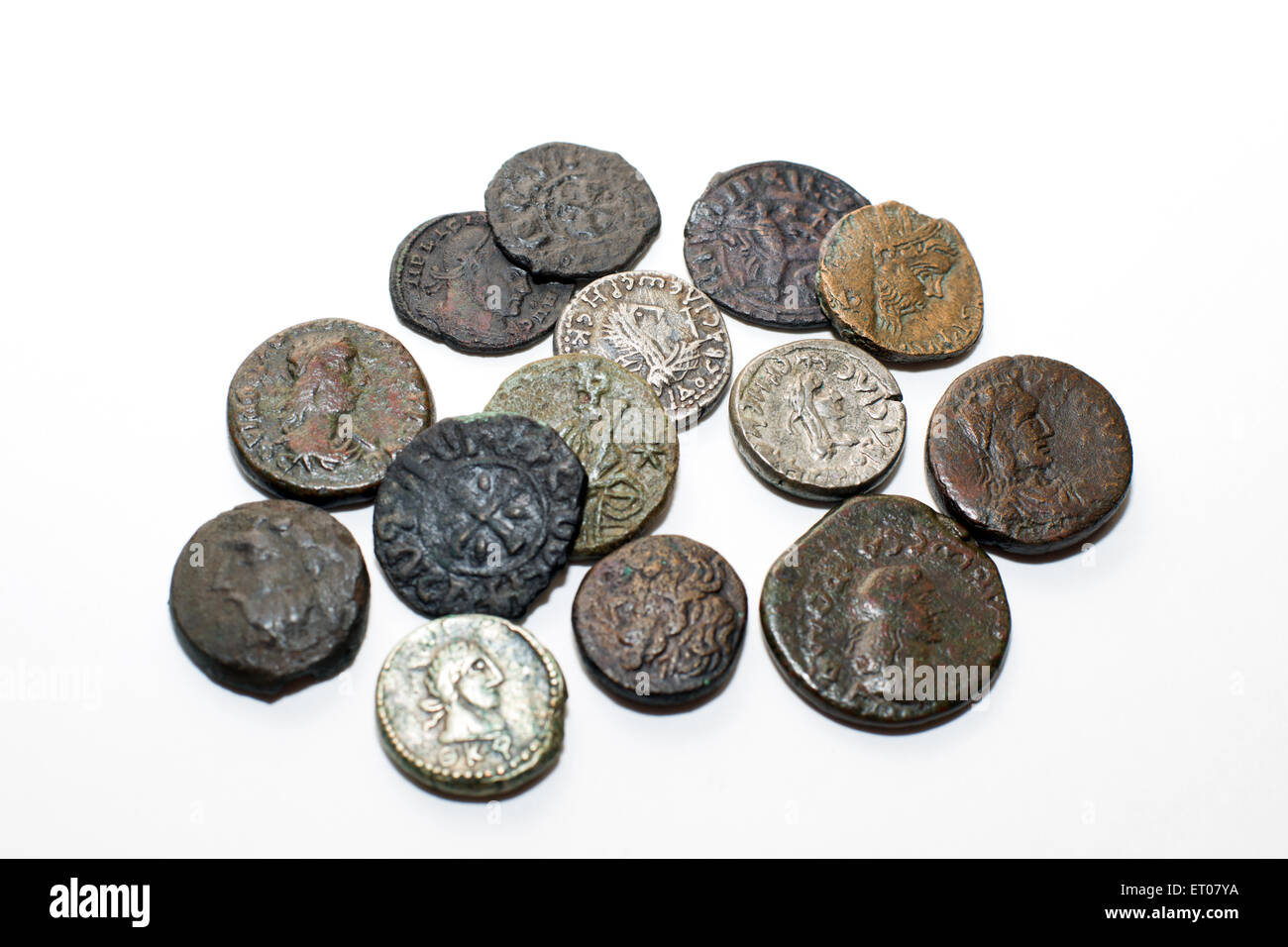 A lot of old  coins with portraits of kings on a white background Stock Photo