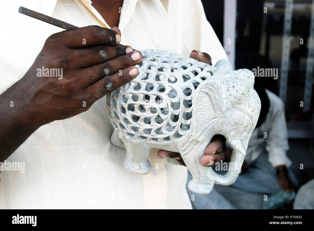 A sculptor making sculptures at Mahabalipuram ; Tamil Nadu ; India