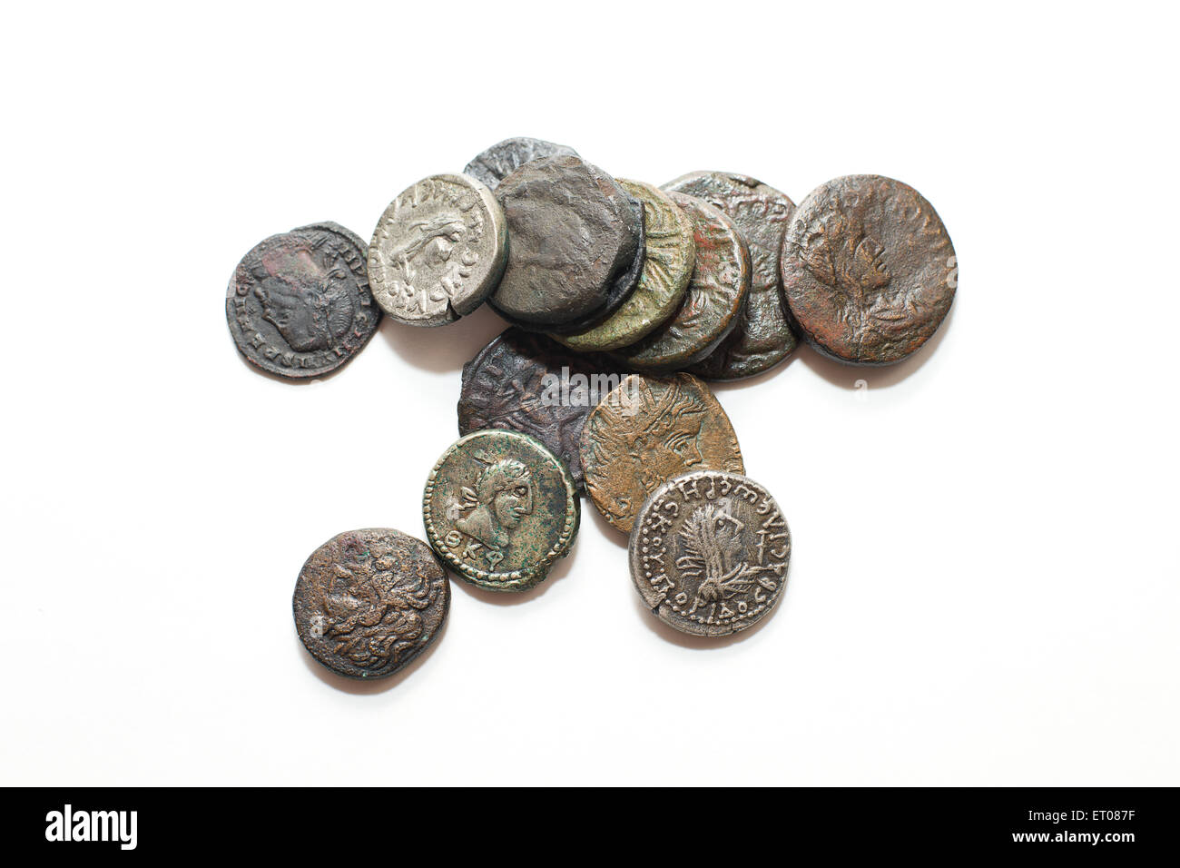 A lot of old silver coins with portraits of kings on a white background Stock Photo