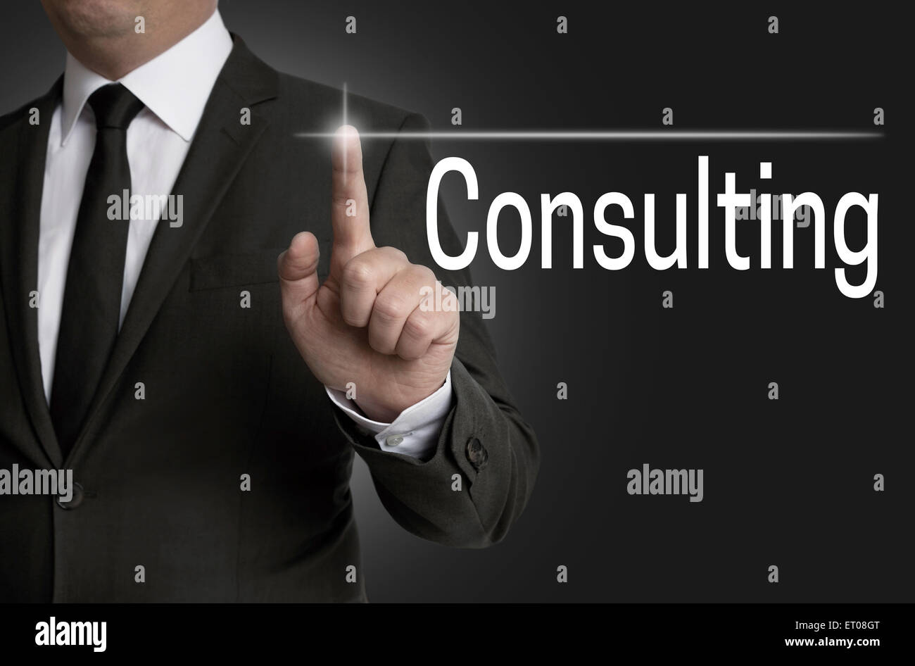 consulting touchscreen is operated by businessman. Stock Photo