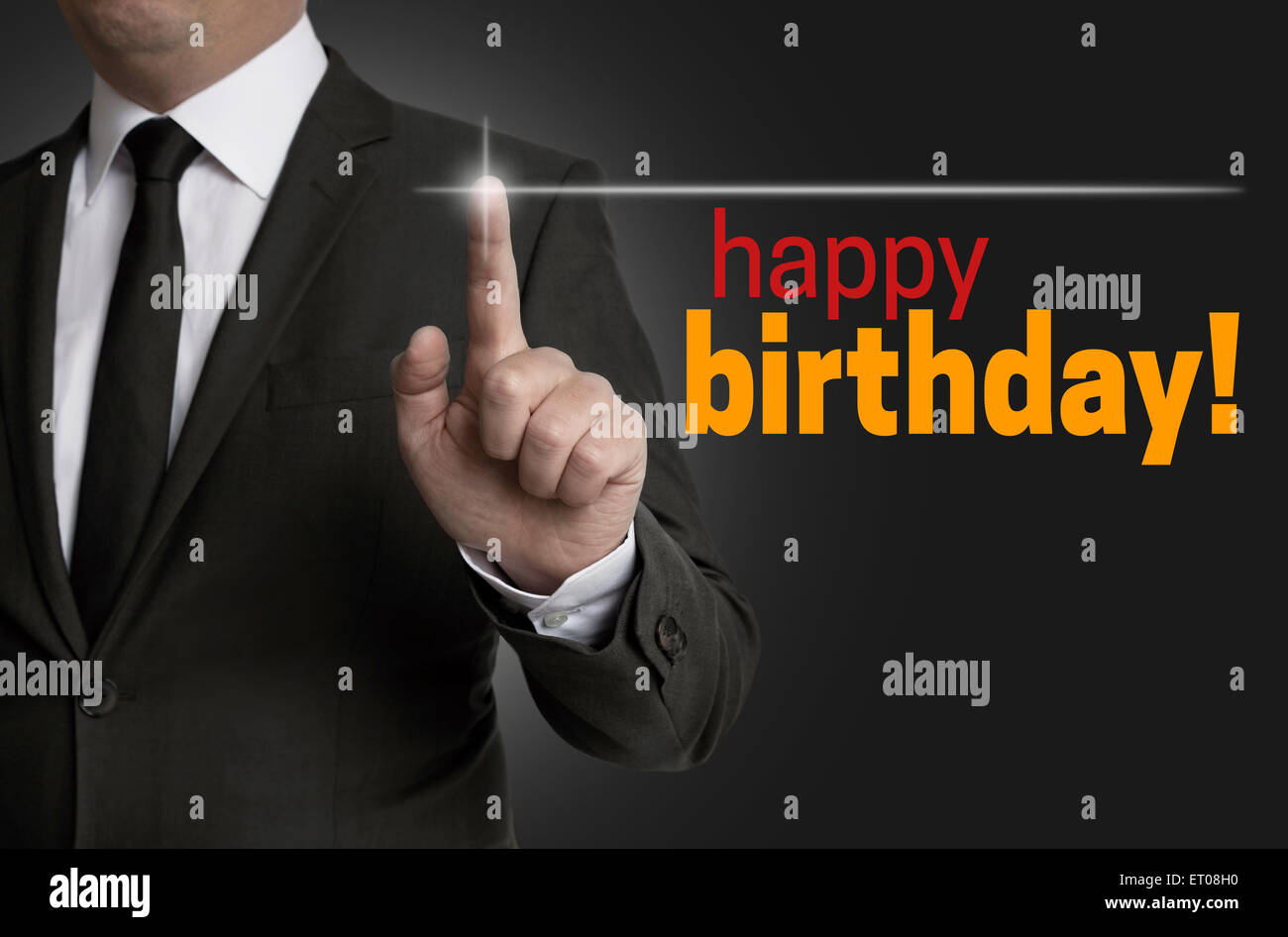 Happy Birthday touchscreen is operated by businessman. Stock Photo