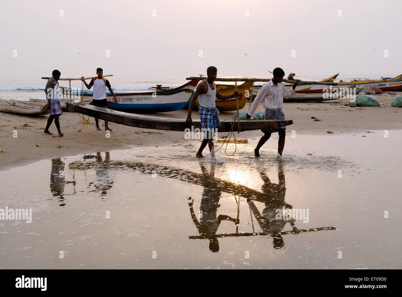Men going in sea for catching fishes ; Chennai ; Tamil Nadu ; India Stock Photo
