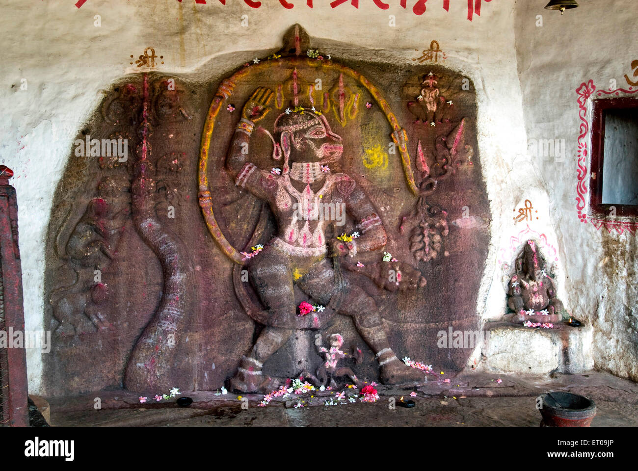 Hanuman shine in a cave in north fort at Badami ; Karnataka ; India Stock Photo
