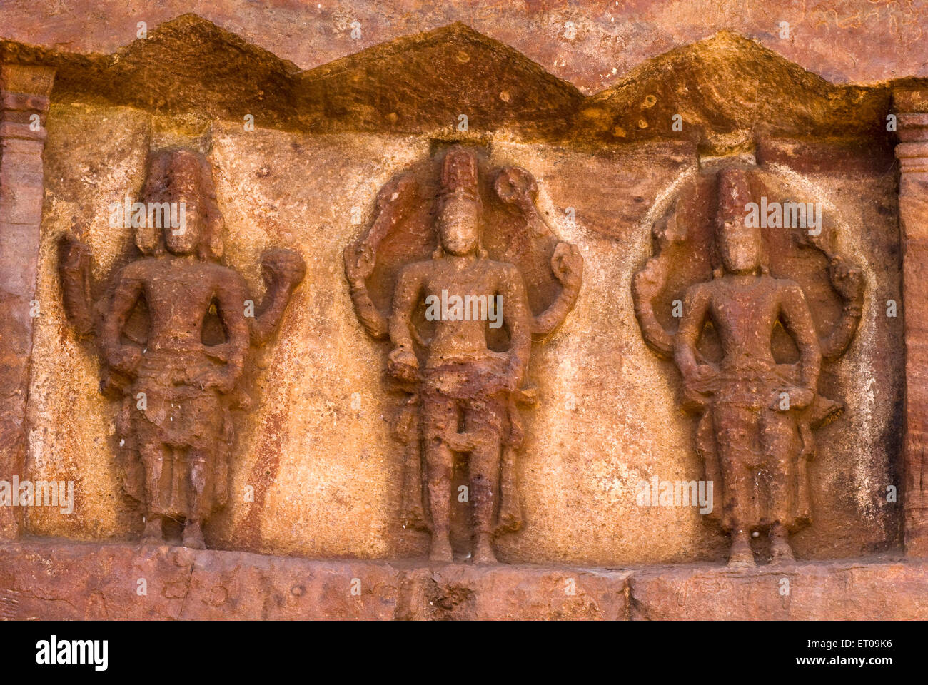 Brahma ; Shiva and Vishnu bas relief in cave temple 7th century ; Badami ; Karnataka ; India Stock Photo