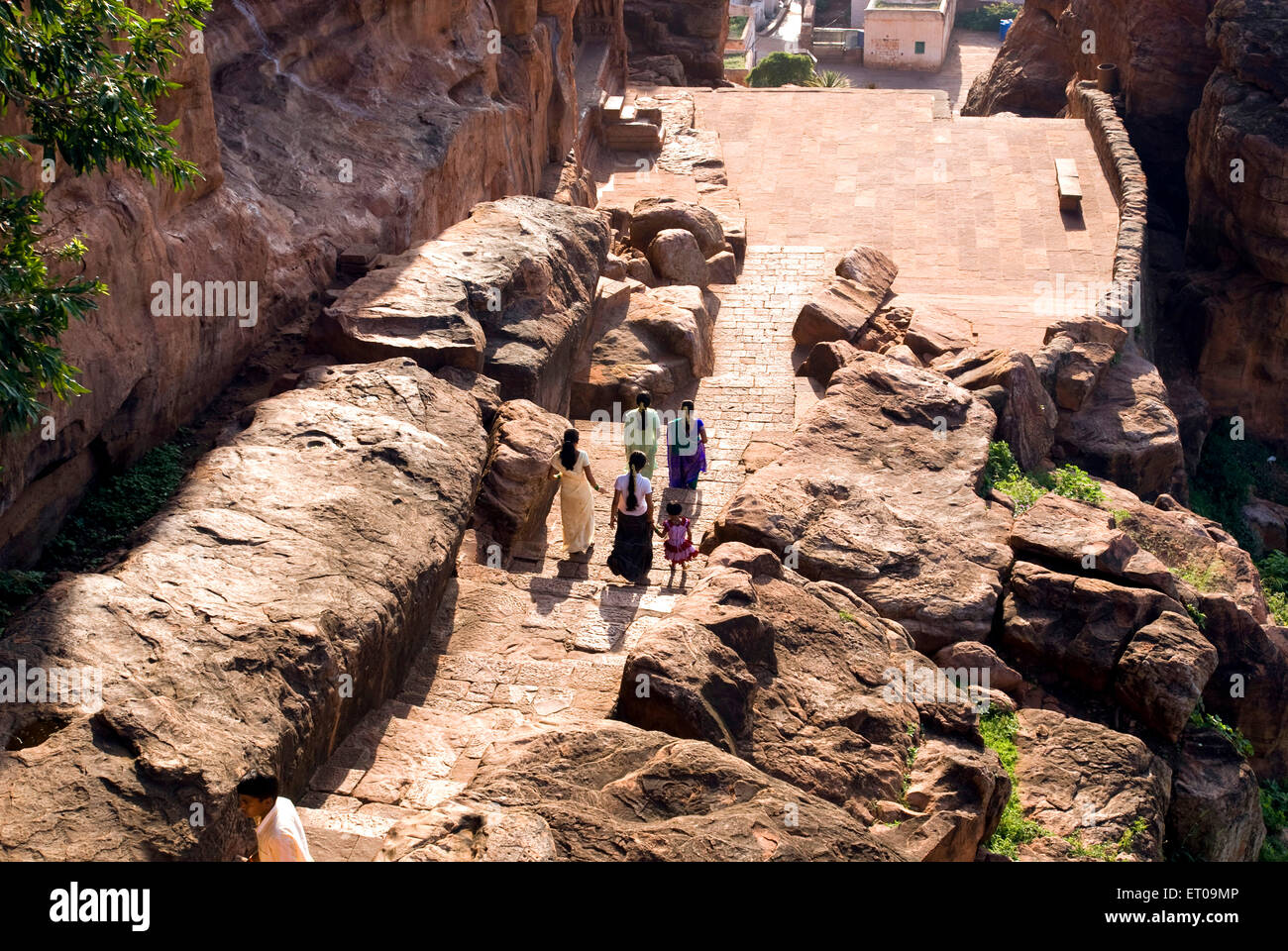 View of the descent Badami cave temples looking west to the town below ; Badami ; Karnataka ; India Stock Photo