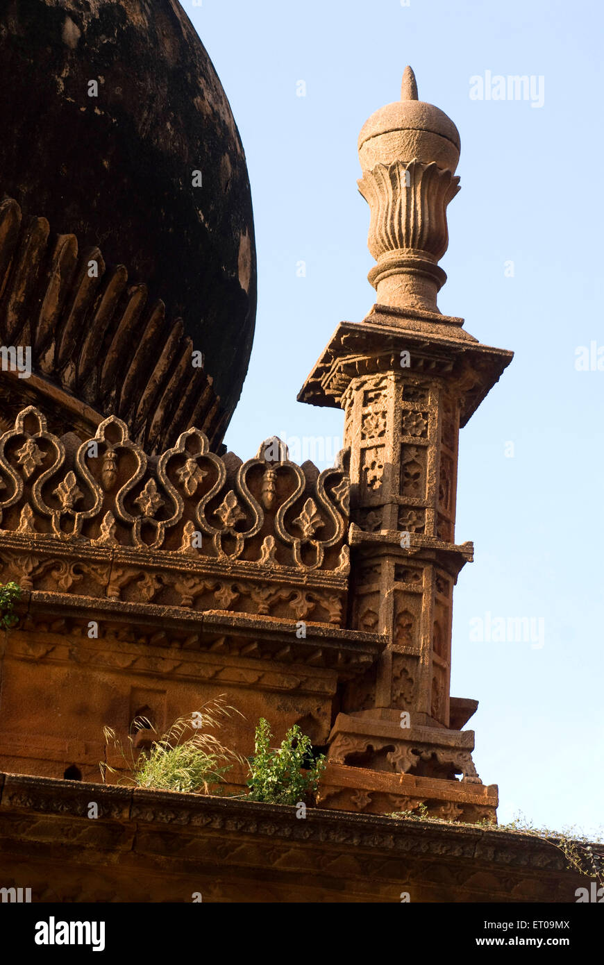 Mosque of Adilshai times ; gumbaz at lower level ; Abdul Aziz raised arch in memory of his wife ; Badami ; Karnataka ; India Stock Photo