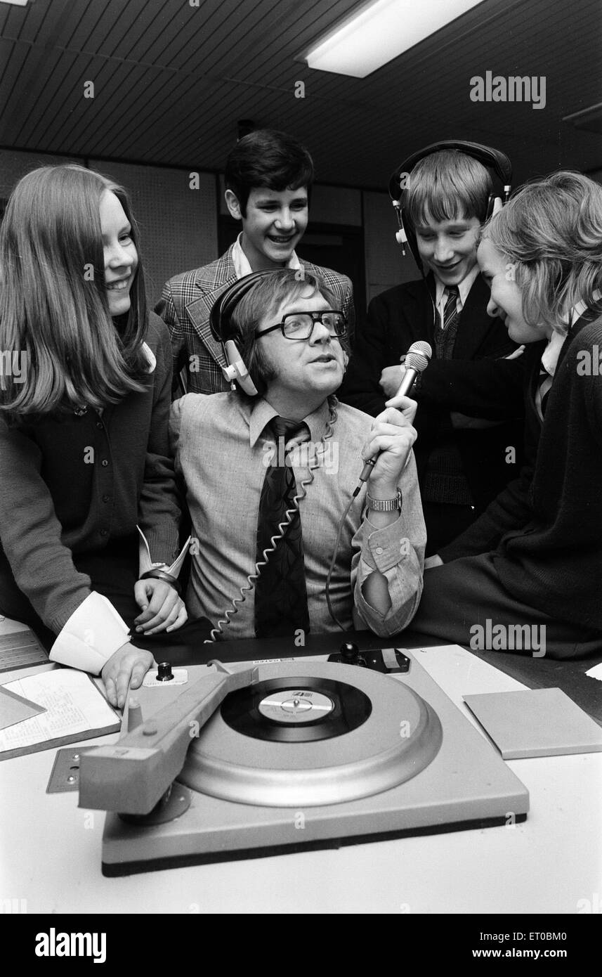 Ed Doolan BRMB Radio Disc Jockey, pictured with news boys and girls, Birmingham, 14th January 1975. Stock Photo