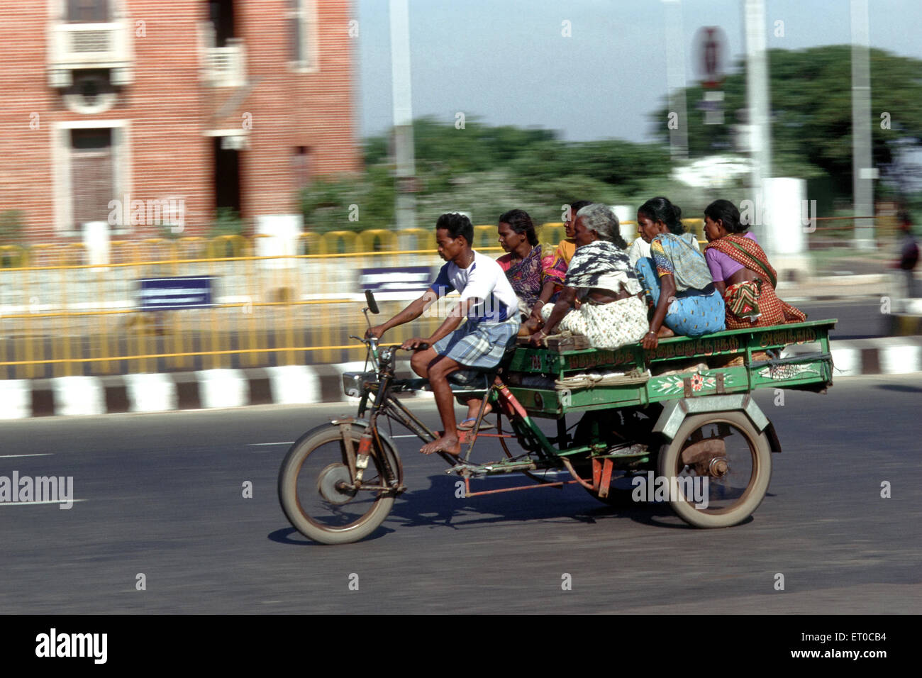 Tricycle ride ; Beach road ; Madras Chennai ; Tamil Nadu ; India Stock Photo