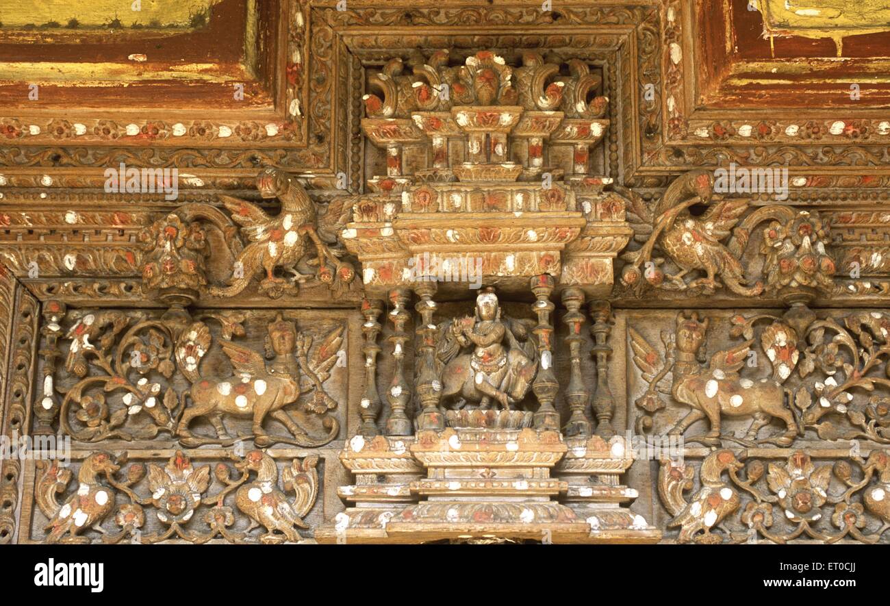 Lord Krishna carved wooden door, Madras, Chennai; Tamil Nadu; India wood relief sculpture, wood relief sculptures, relief sculpture, relief sculpture Stock Photo