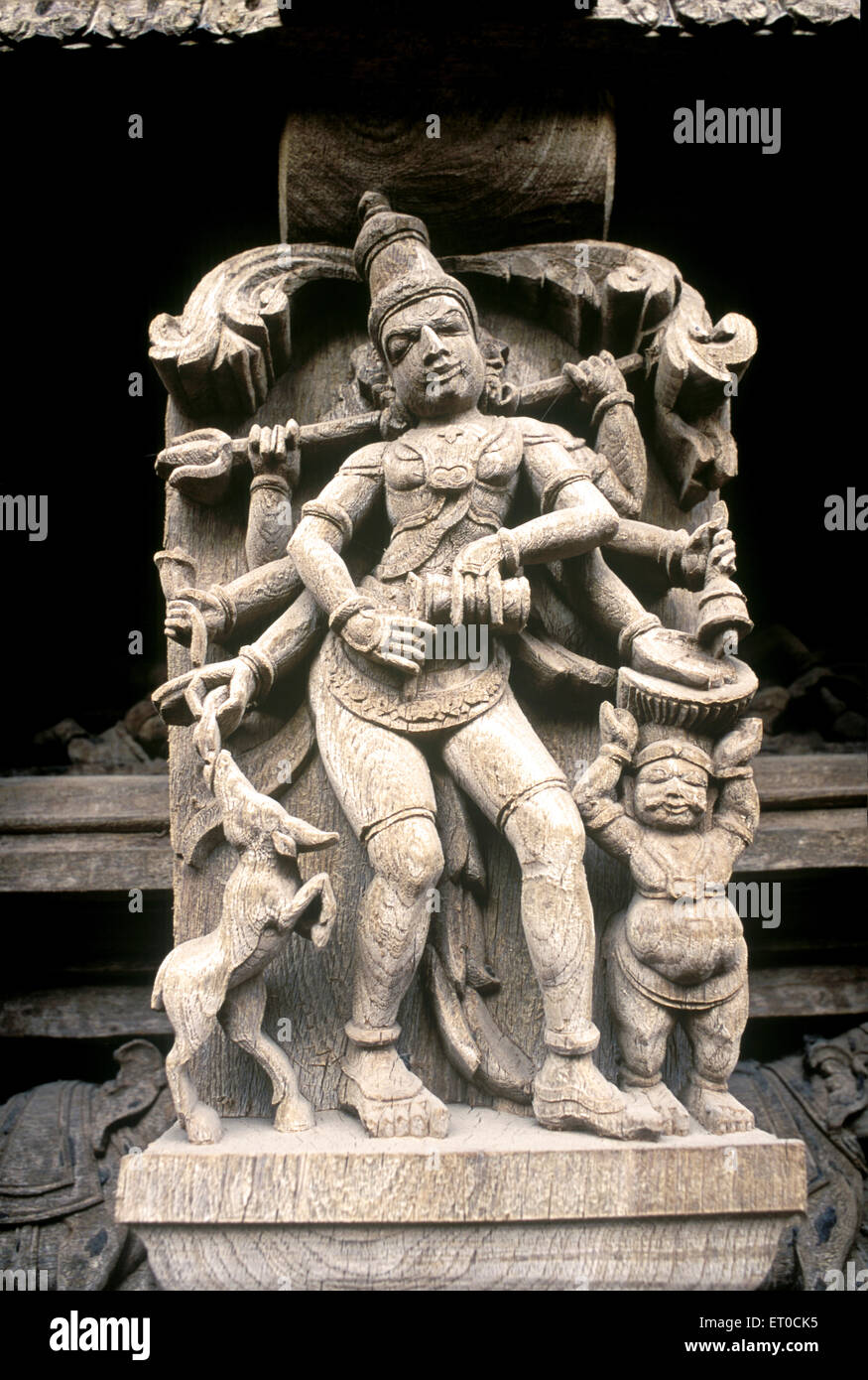 Gangala murthy one of sixty four forms of lord Shiva wooden carving statues in old temple chariot at Madurai Stock Photo
