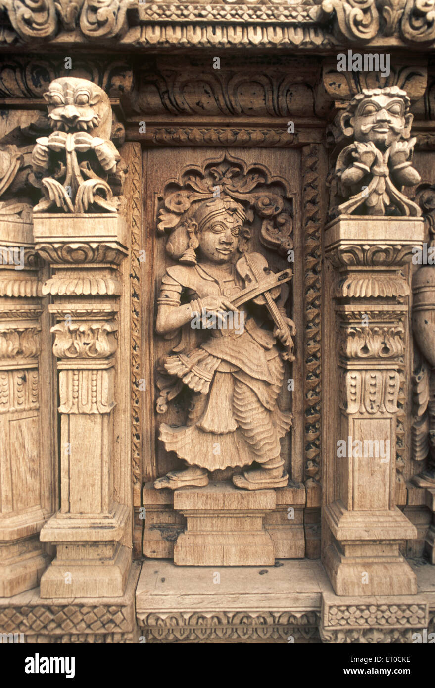 Lady with violin wooden carving statues in old temple chariot at Madurai ;  Tamil Nadu ; India Stock Photo - Alamy
